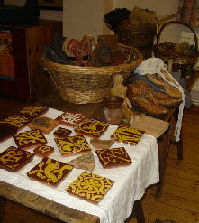 Medieval tiles set out for a W.I talk and presentation