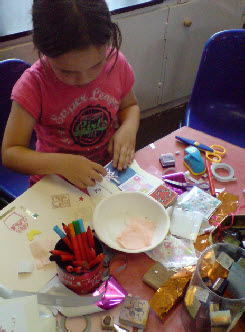 Children's card making session with coloured inks and stamps