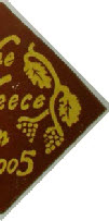 Handmade tile depicting barley and grapes