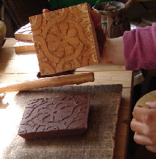 Stamped clay tile with medieval daisy chain impressed pattern