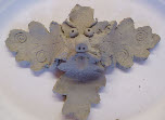 Green man clay leaf sculpture