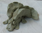 medieval dragons take and paint hands on clay