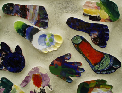 Colourful glazes painted feet and hands tiles