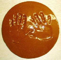 Impressed baby hands in clay show all of the details