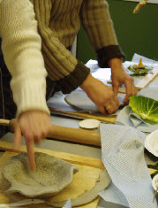 Teachers roll out clay to create bowls