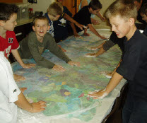 pupils felting the school felt banner depicting a Samuel Palmer nightscape