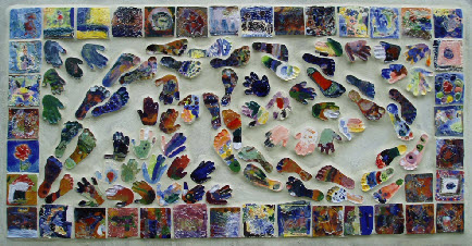 Clay feet tiles made by infant school pupils swim in a border of year one tiles