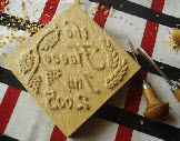 Reversed lettering for hand carved wood tile block