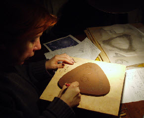 Hand carved clay patterns create a unique design for house numbers and letters