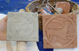 wooden tile stamp inspires a medieval lion tile