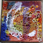 Impressions made with simple tools into clay to make a decorated tile