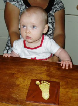 Baby foot tile in slip and honey glaze
