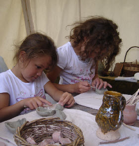 A witch pot acts as inspiration for these two girls