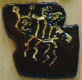 Traditional slip and honey glazed mini beast tile