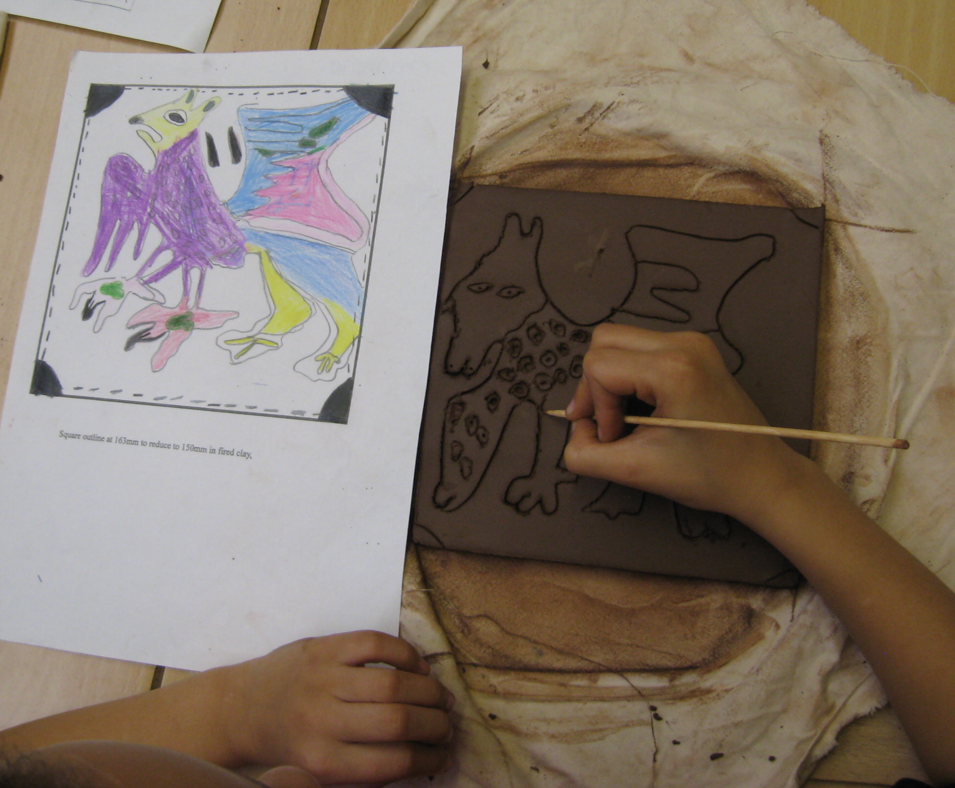 Child drawing Griffin tile